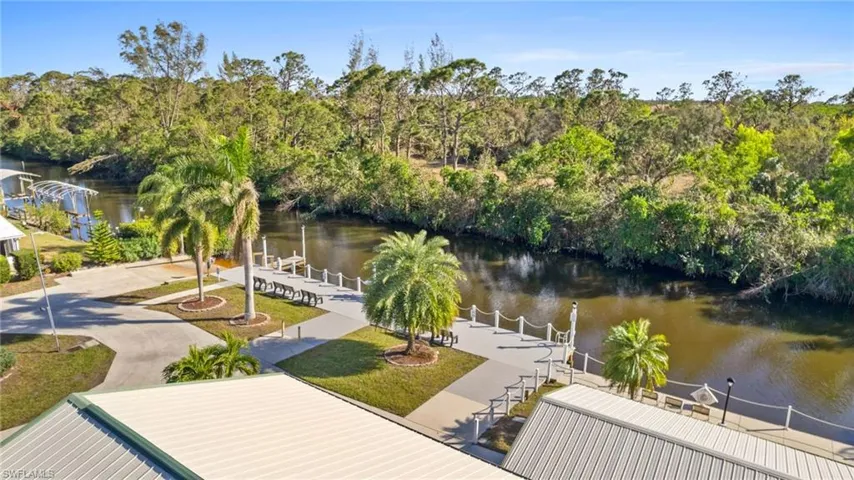View of dock featuring a water view and a yard