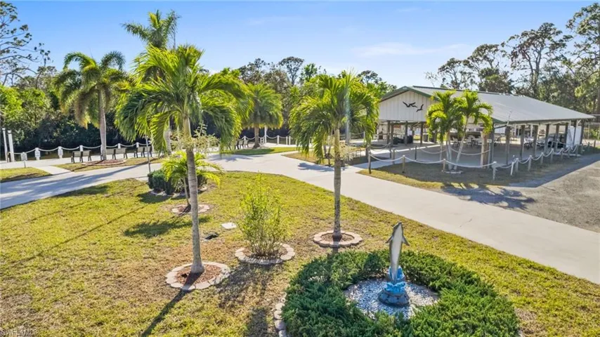 View of home's community featuring a yard