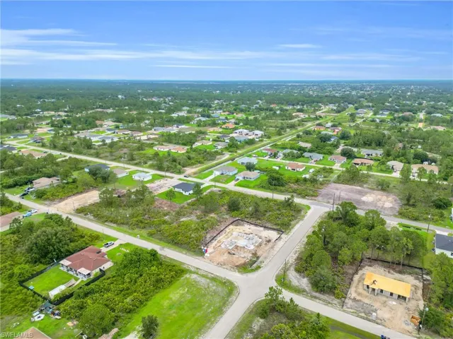 Aerial view of property's location featuring nearby suburban area