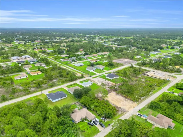 Aerial overview of property's location with nearby suburban area