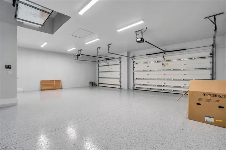 Garage featuring a garage door opener