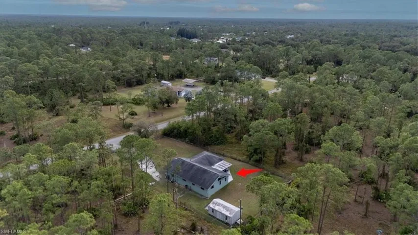 Birds eye view of property from rear of home looking southeast