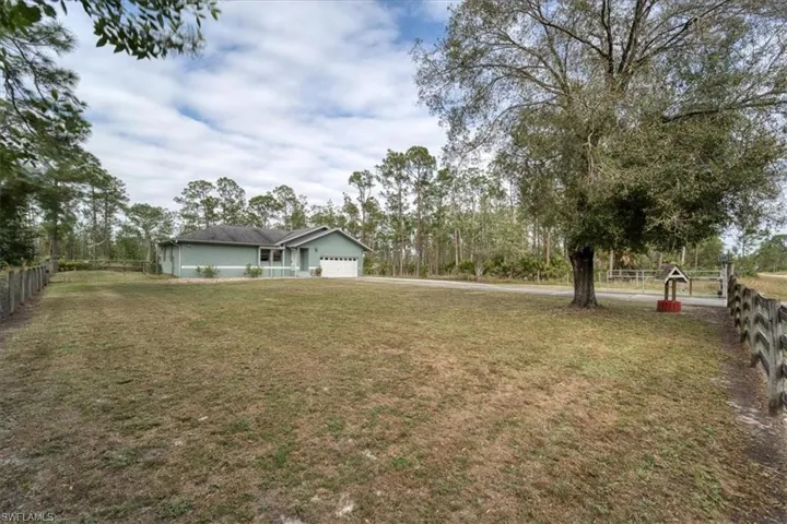View of yard featuring a garage