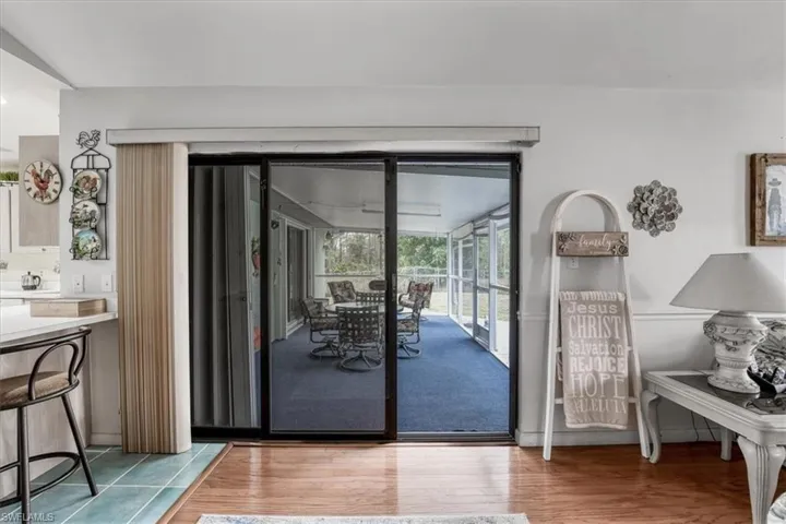 Doorway to outside featuring hardwood floors