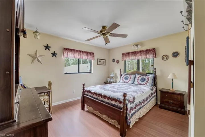 Bedroom featuring  wood-style floors and ceiling fan
