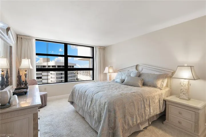 With King sized bed, carpeted flooring