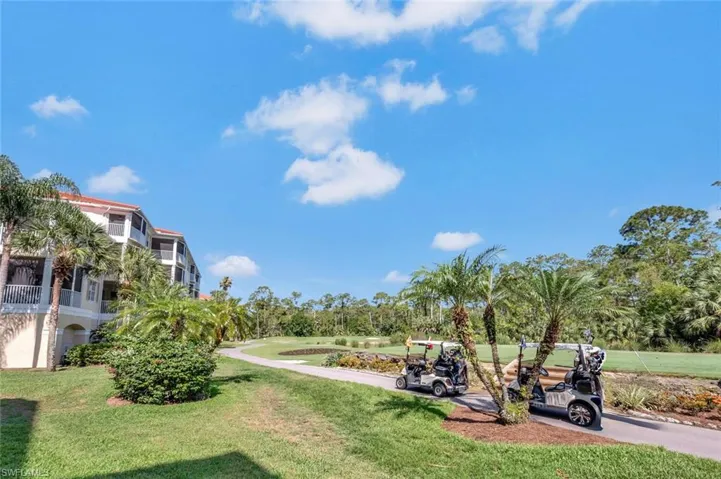 View of property's community featuring a yard