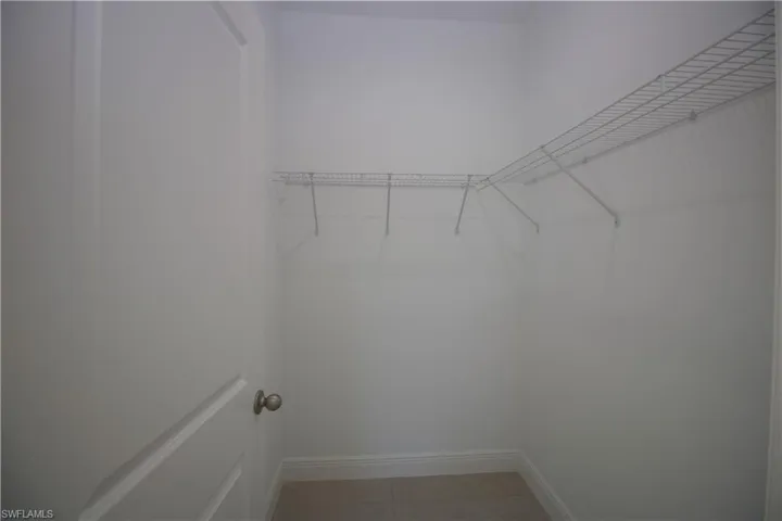 Bedroom featuring light tile patterned flooring