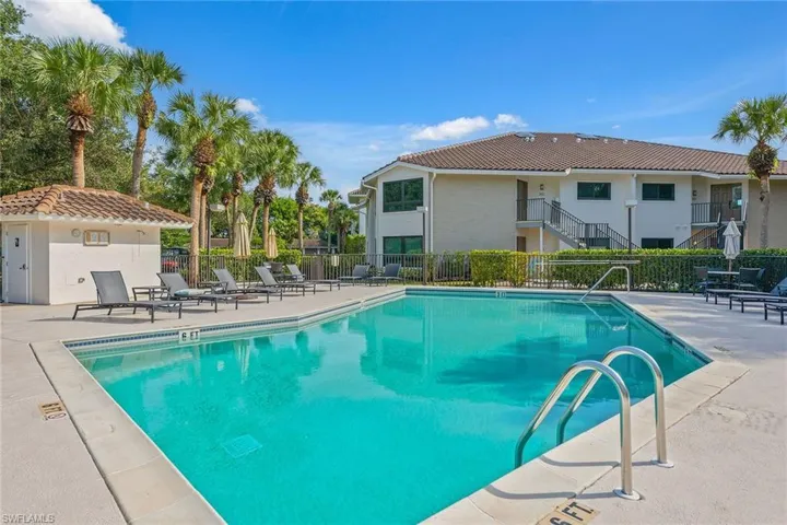 Community pool with a patio area