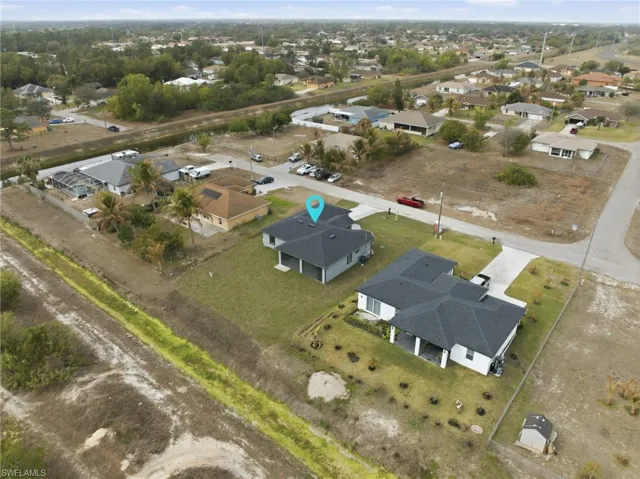 View of property location with nearby suburban area