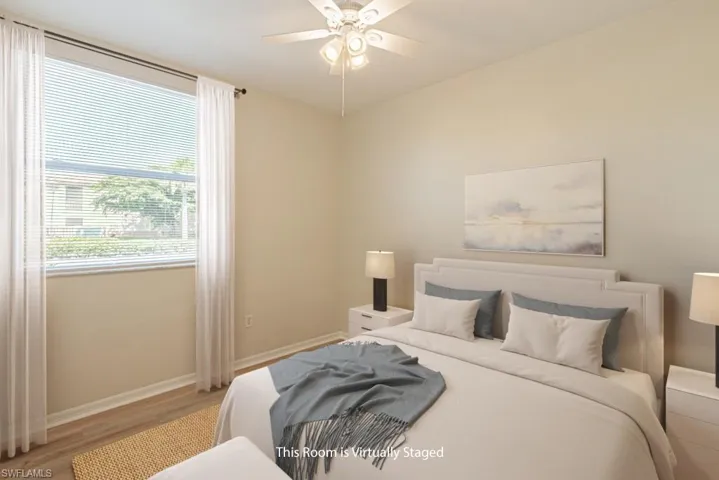 Bedroom with wood finished floors and a ceiling fan