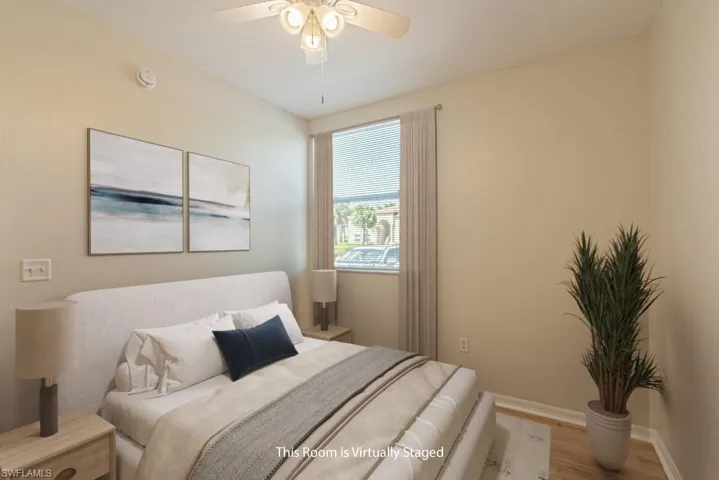 Bedroom with wood finished floors and a ceiling fan