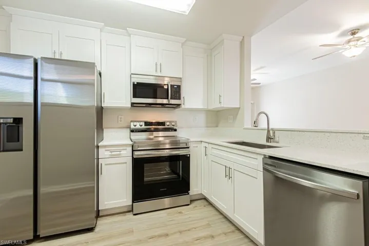 Beautifully updated with Quartz Counter Tops and Stainless Steel Appliances