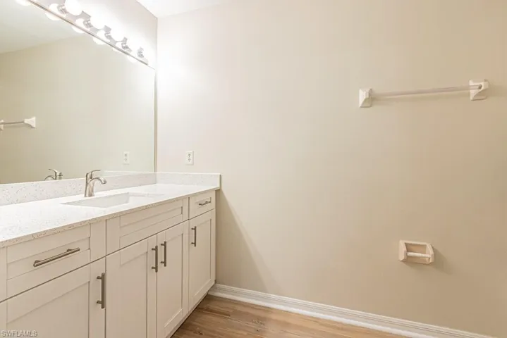 Large Quartz Vanity . Updated Sink and Flooring. Lots of space ! Right off the Primary Bedroom.  New tiolets