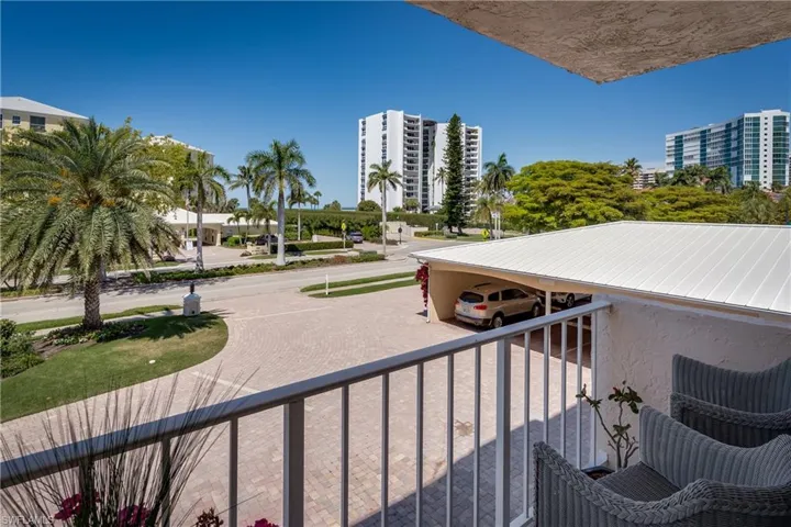 Sitting on the Primary Bedroom's Front Balcony looking across to the Gulf