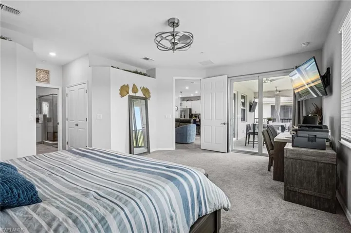 Bedroom featuring carpet, access to exterior, and recessed lighting