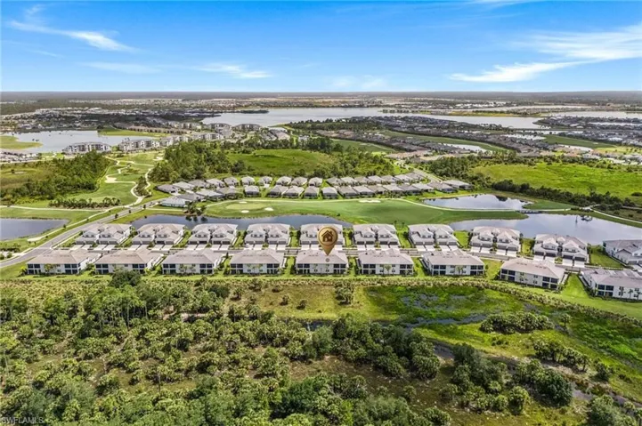 Aerial view of residential area featuring a large body of water