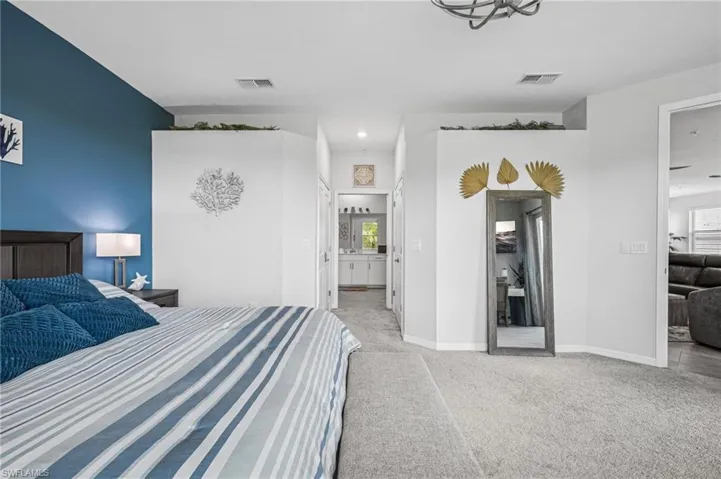 Bedroom with carpet floors and recessed lighting