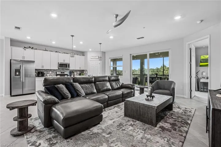 Living area featuring recessed lighting and tile