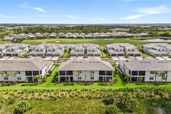 Aerial view of residential area with a nearby body of water