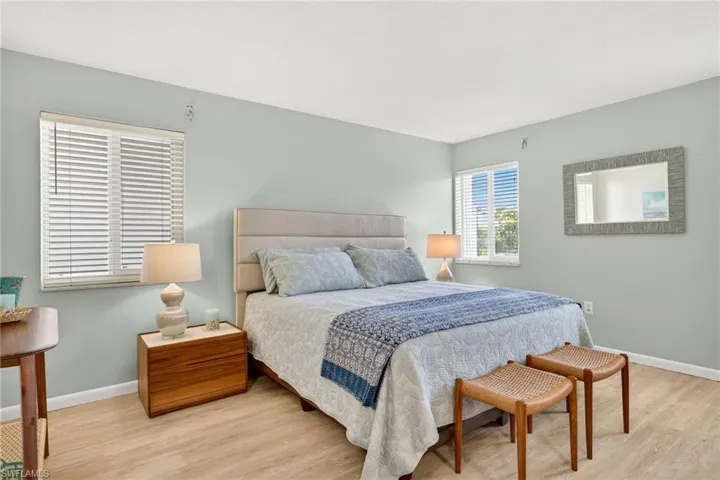 Bedroom with light wood-style flooring and baseboards