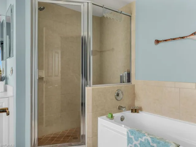 Bathroom featuring plus walk in shower