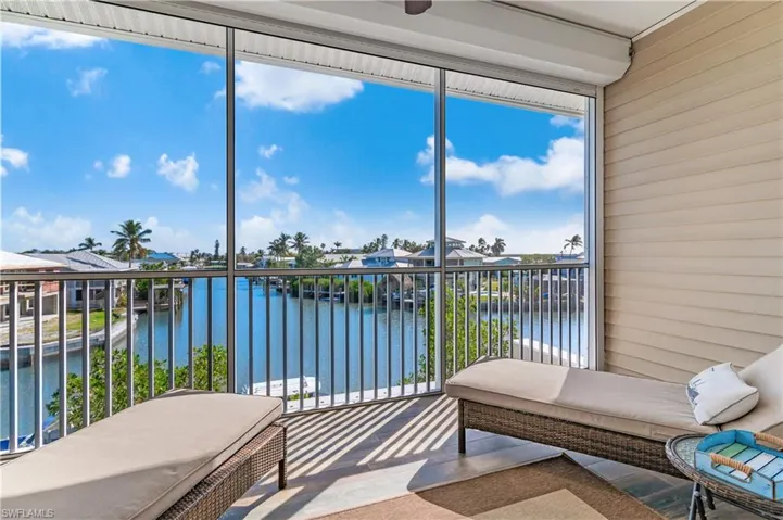 Sunroom with a water view