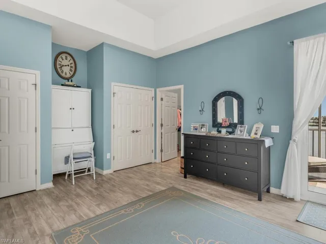 Bedroom with light hardwood / wood-style floors