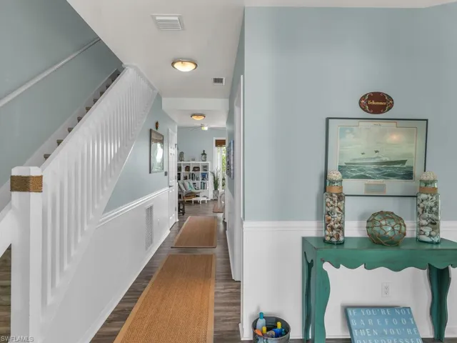 Corridor featuring dark wood-type flooring
