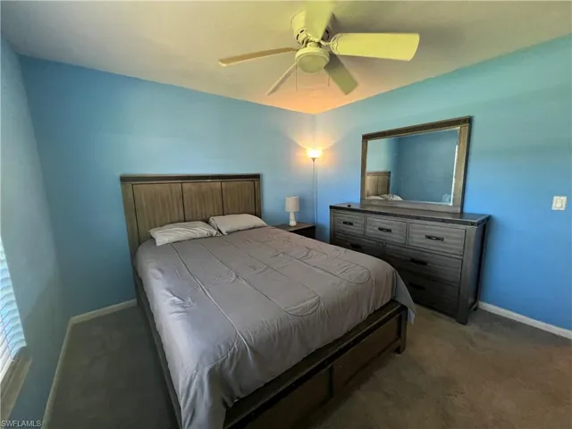 Bedroom featuring carpet floors and ceiling fan