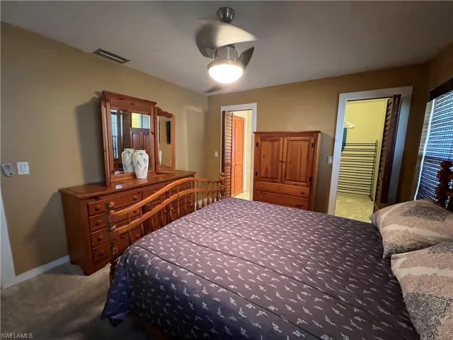 Bedroom featuring carpet flooring and a ceiling fan