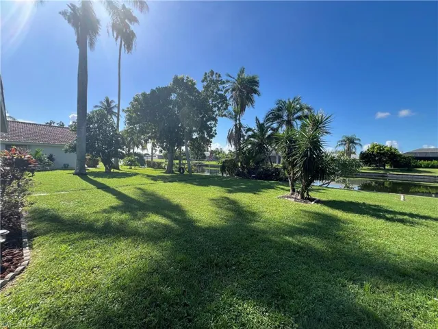 View of grassy yard featuring a water view