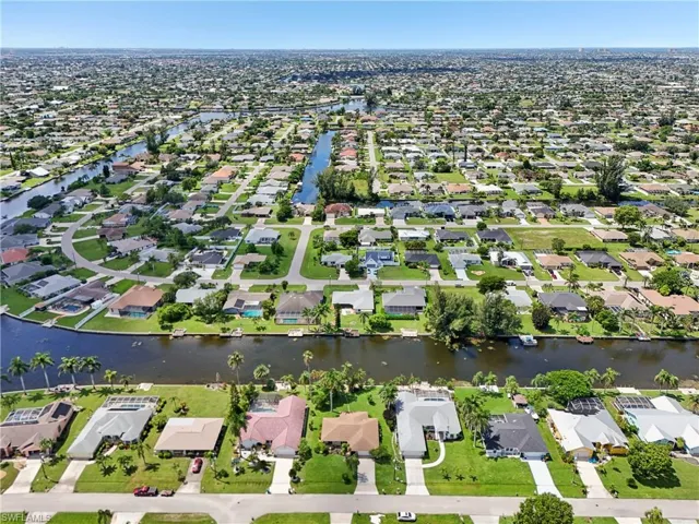 View of property location with nearby suburban area and a large body of water