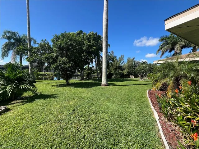 View of green lawn with a water view