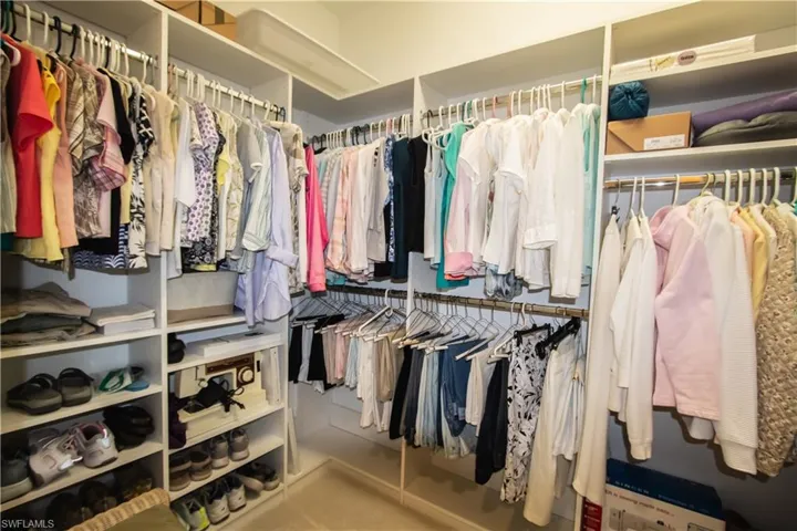 Large walk-in closet with built-in storage system