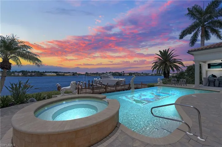 View of swimming pool featuring an in ground hot tub and a patio area