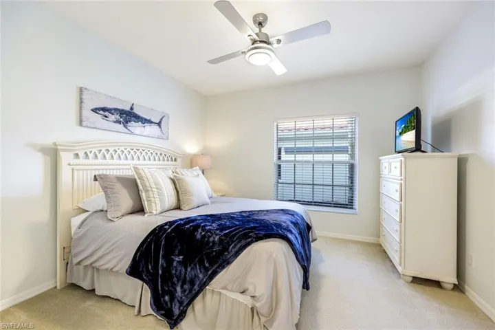 Guest bedroom, privately tucked away from the primary on the opposite side of the home.