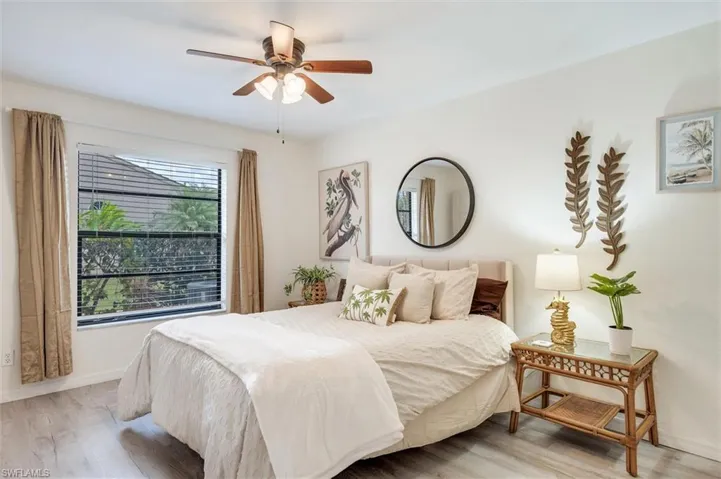 Bedroom featuring light wood-style flooring and ceiling fan
