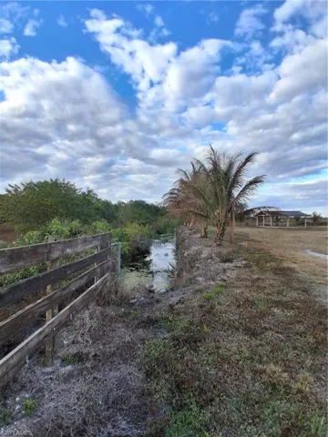 View of yard with a water view