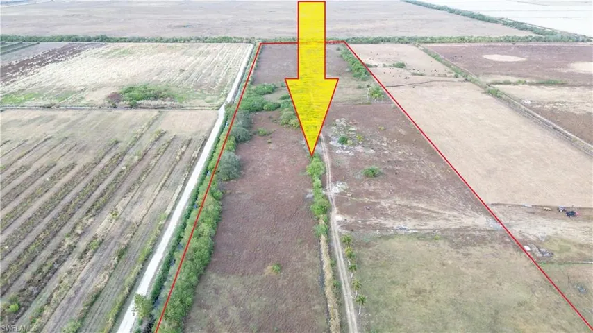 Overview of rural landscape with large plots for crops and property boundaries highlighted