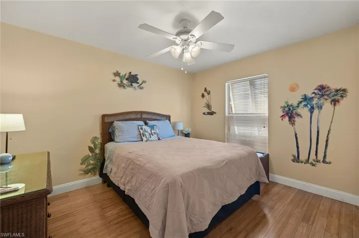 Bedroom featuring ceiling fan and light hardwood / wood-style floors