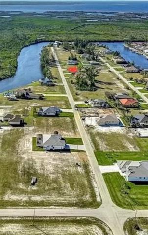 Note the small strip across the street from the Lot.  This is owned by the City of Cape Coral with views of the water !!