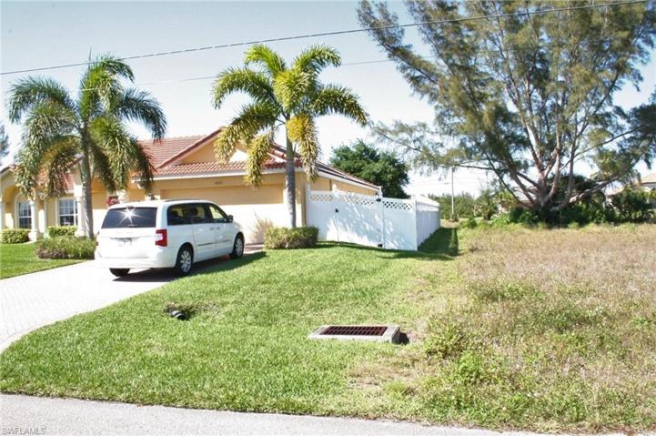 Nice Home next door to the left, vacant lot is to the right.  Home to the left is well maintained with Tile Rood and custom PVC fence for privacy next door.