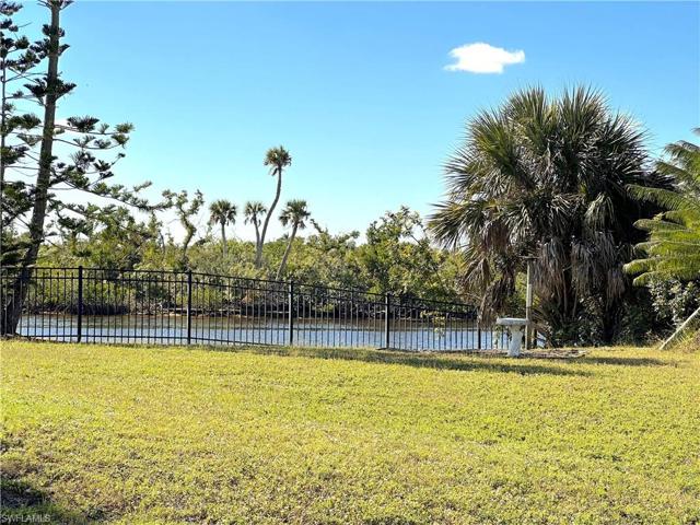 View of Water Across Street!  This is the extra lot belonging to the house across the street.  The lot has been cleared for full time views !!