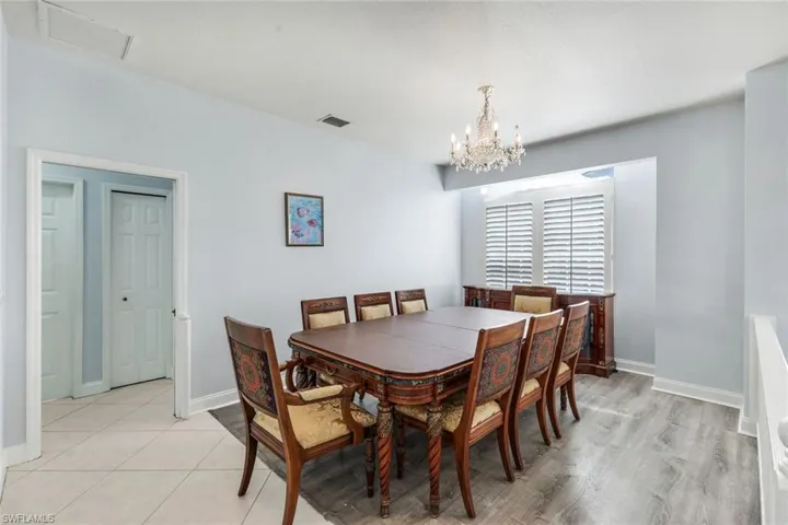 Dining room with baseboards and hanging lights