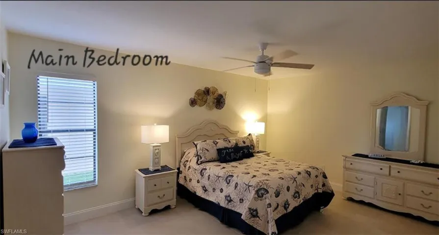 Master Bedroom with baseboards, All NEW tile , and ceiling fan,