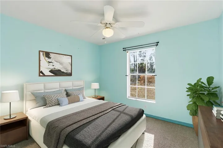 Bedroom featuring carpet flooring and a ceiling fan
