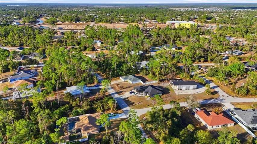 Aerial overview of property's location with nearby suburban area