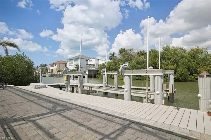 Paver area with attached boat dock featuring 20,000 pound boat lift