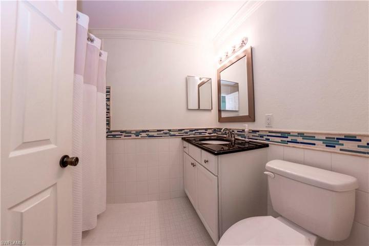 Guest Bathroom with a tub/shower combination.